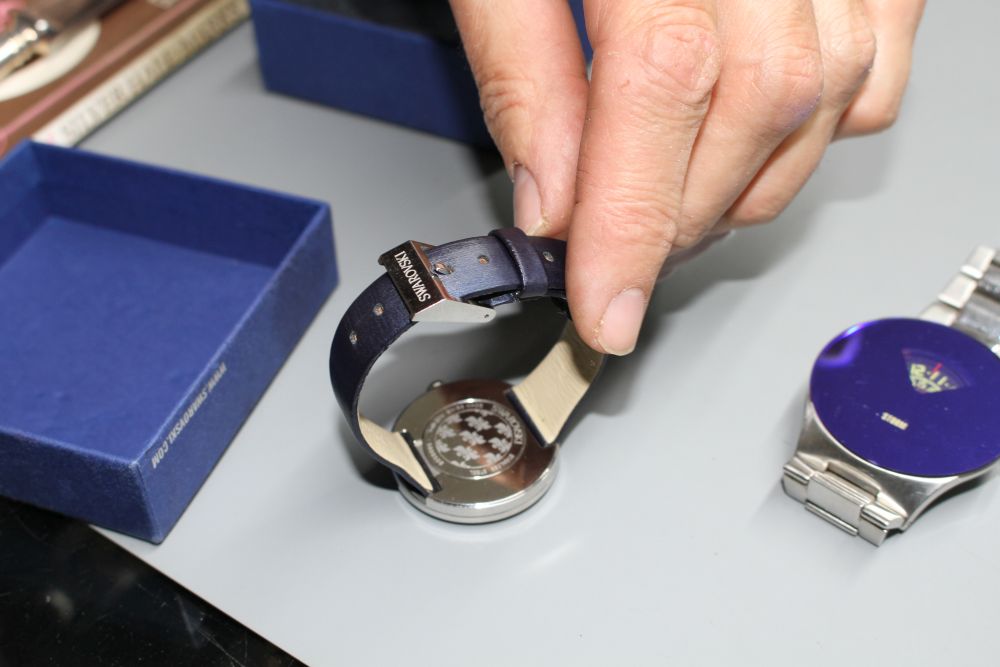 Two gentlemans modern wrist watches, Storm and Swarovski.